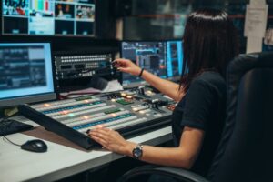 A female audio producer working in her studio