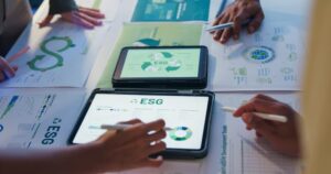 A close-up of a working group assessing ESG and environmental risk management data