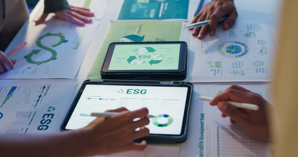 A close-up of a working group assessing ESG and environmental risk management data
